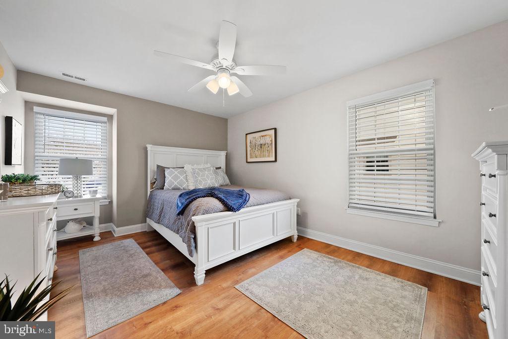 133 Tavistock Cherry Hill, NJ 08034 - Photo 17 of 35 a bedroom with a bed and a chandelier