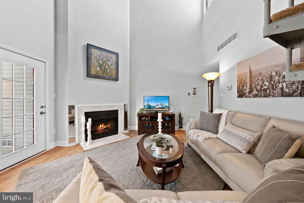 133 Tavistock Cherry Hill, NJ 08034 - Photo 2 of 35 a living room with furniture and a fireplace