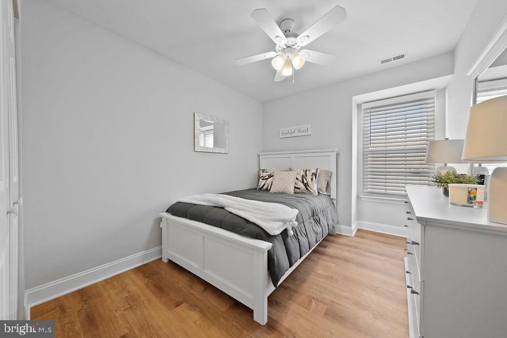 133 Tavistock Cherry Hill, NJ 08034 - Photo 21 of 35 a bedroom with a bed and a chandelier