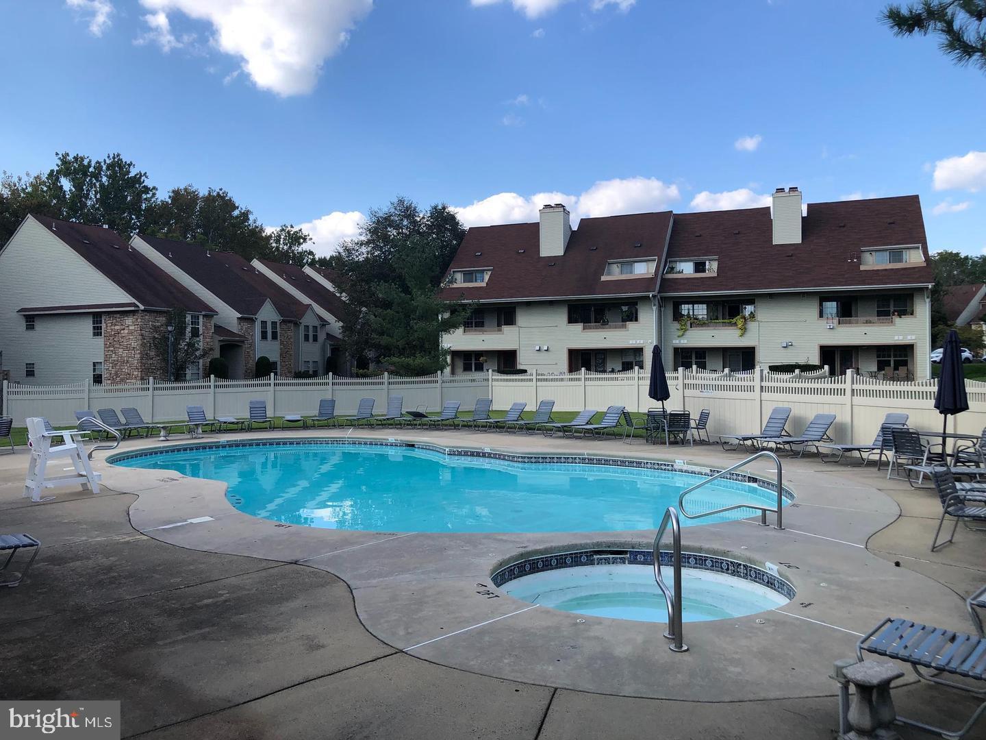 133 Tavistock Cherry Hill, NJ 08034 - Photo 32 of 35 a view of a house with pool lawn chairs and a yard