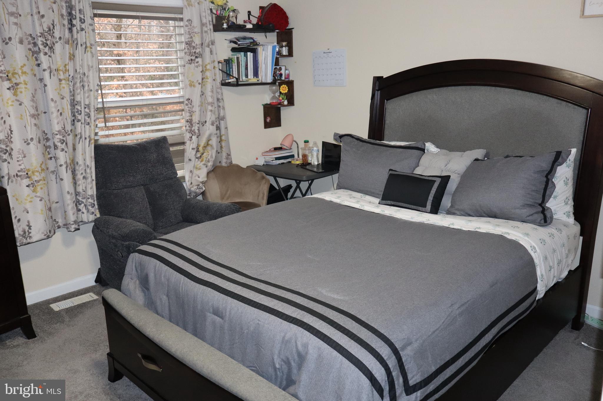 10916 Bridle Path Circle Waldorf, MD 20601 - Photo 18 of 31 a bed room with a bed and a chair