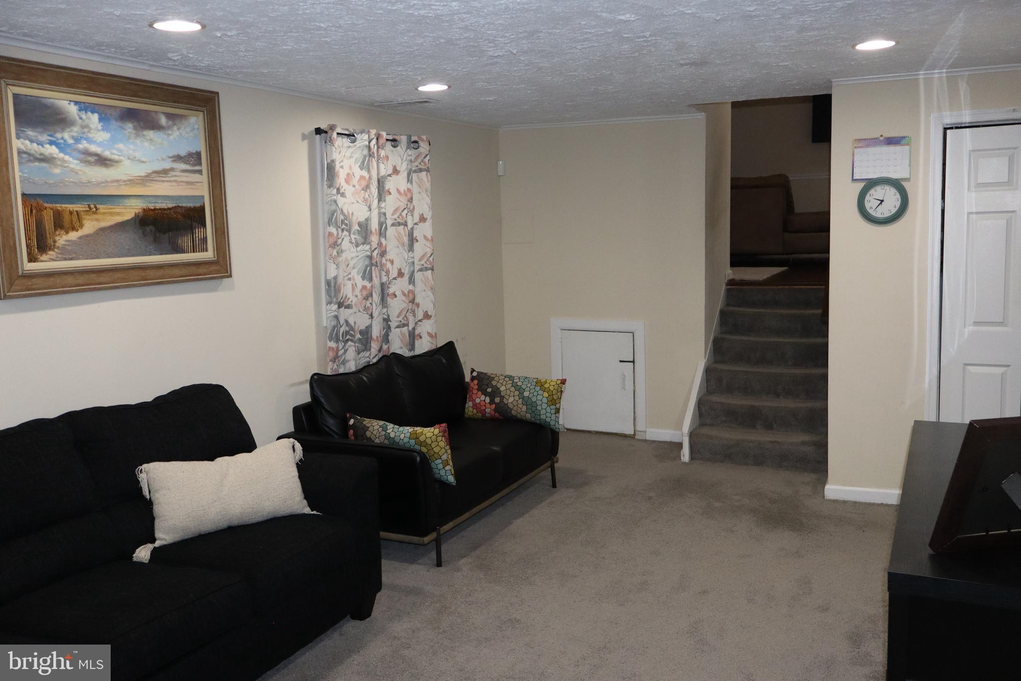 10916 Bridle Path Circle Waldorf, MD 20601 - Photo 21 of 31 a living room with furniture and a window