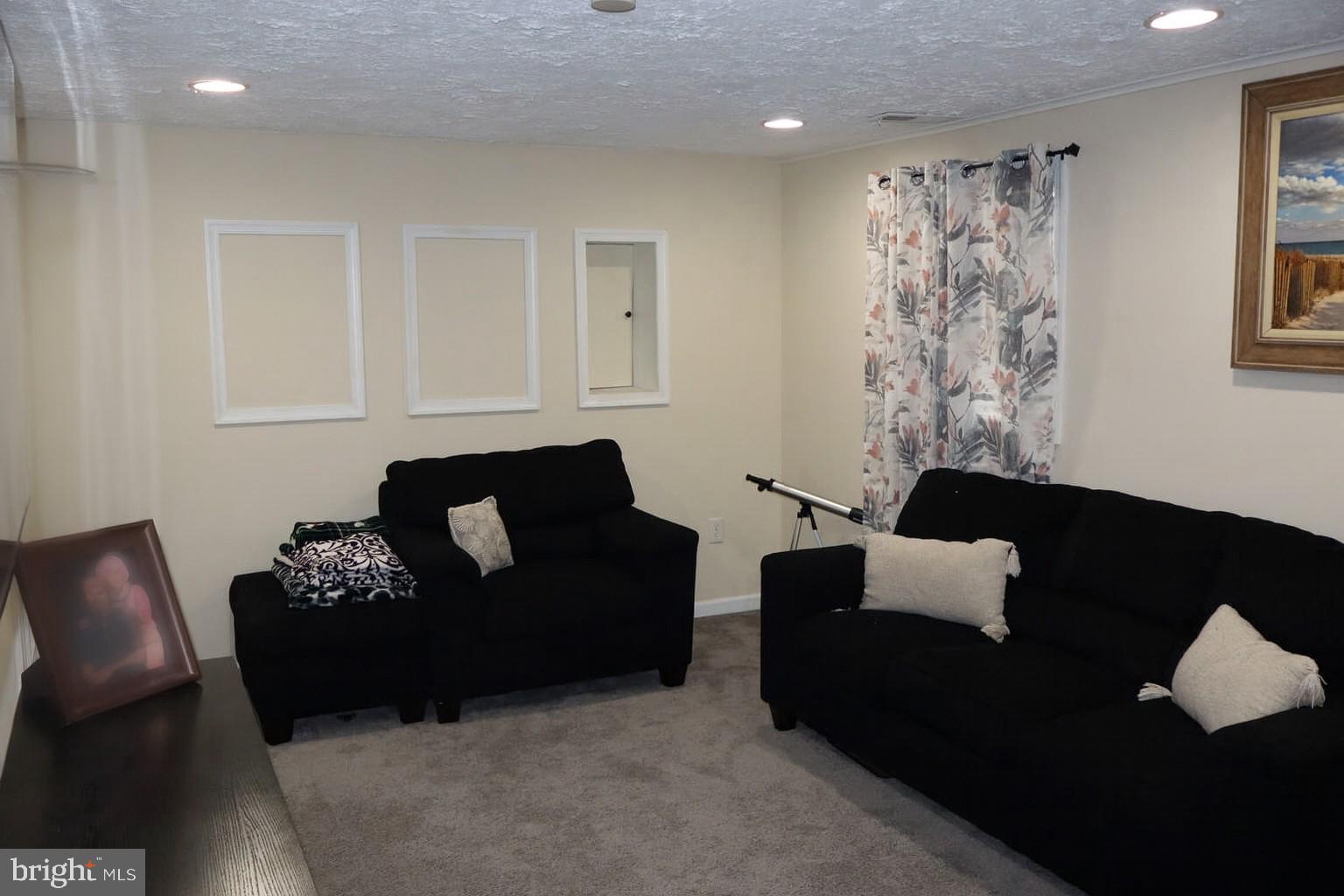 10916 Bridle Path Circle Waldorf, MD 20601 - Photo 23 of 36 a living room with furniture and a couch