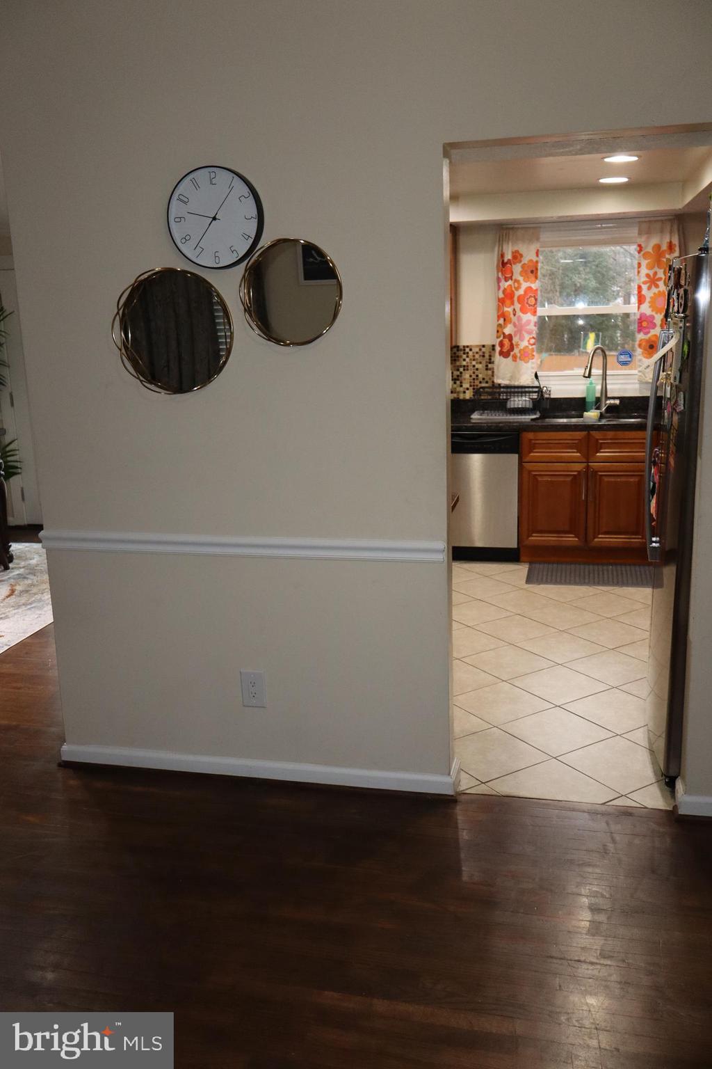 10916 Bridle Path Circle Waldorf, MD 20601 - Photo 27 of 36 a kitchen with granite countertop a refrigerator a stove and a sink