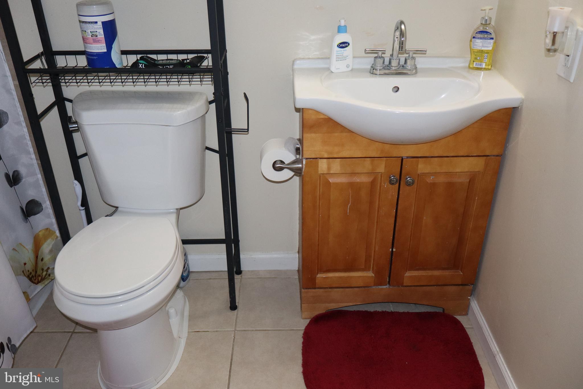 10916 Bridle Path Circle Waldorf, MD 20601 - Photo 30 of 36 a bathroom with a sink toilet and shower