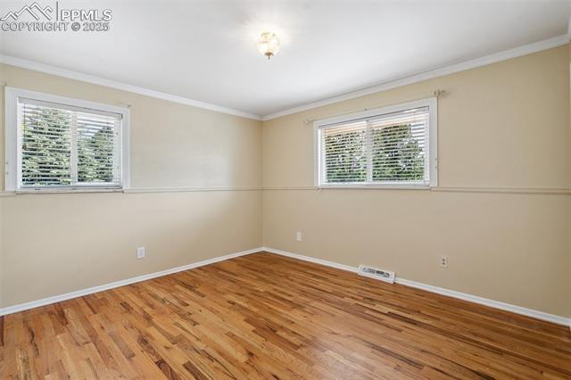 1244 Baron Road Colorado Springs, CO 80920 - Photo 20 of 44 Upper Level Bedroom w/natural hardwood floors