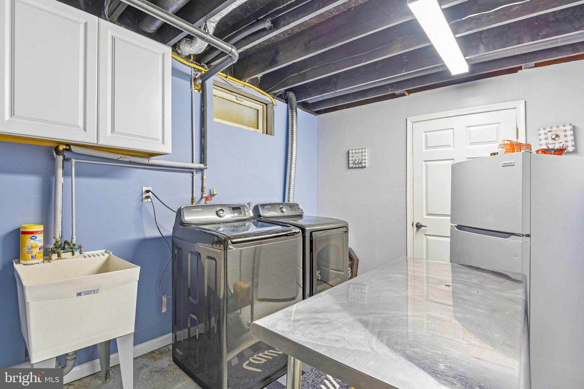 306 Watertons Way Joppa, MD 21085 - Photo 40 of 50 a kitchen with a sink appliances and cabinets