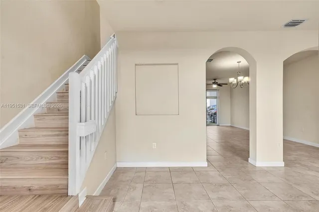 a view of a hallway with staircase