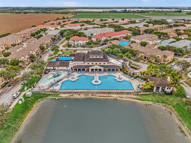 an aerial view of a house with a lake view