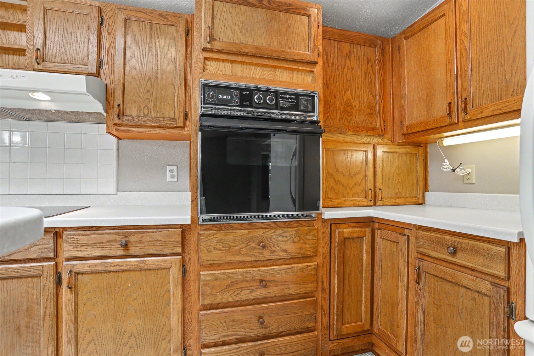 905 243rd Street Southwest Bothell, WA 98021 - Photo 5 of 37 a view of a kitchen with appliances and cabinets
