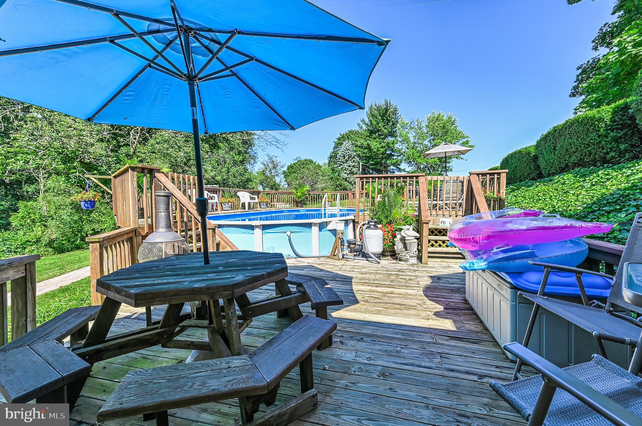 1000 Littlestown Road Littlestown, PA 17340 - Photo 54 of 62 a view of a patio with table and chairs under an umbrella