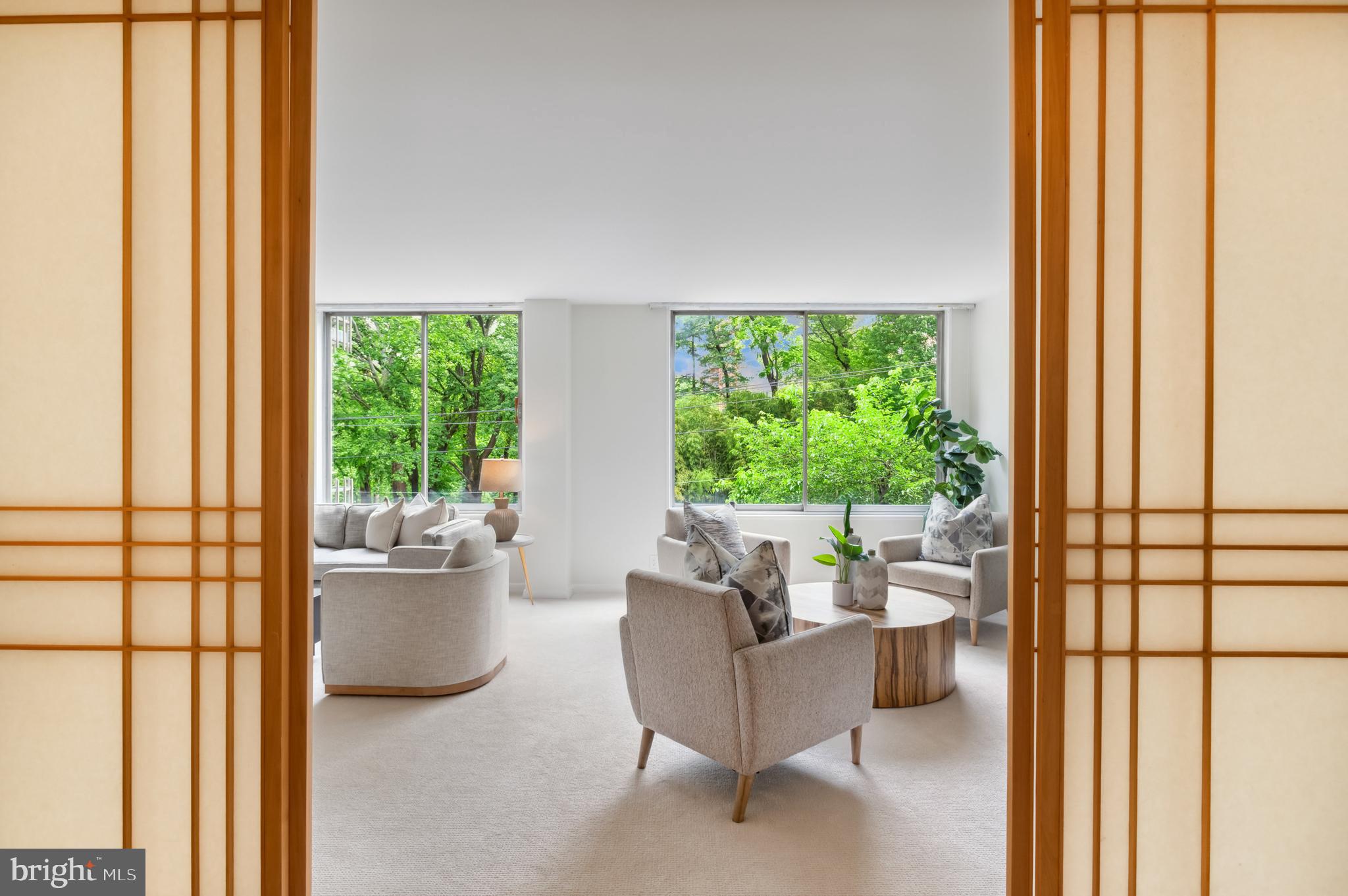 4100 Cathedral Avenue Northwest, Unit 709 Washington, DC 20016 - Photo 14 of 20 a living room with furniture and a large window