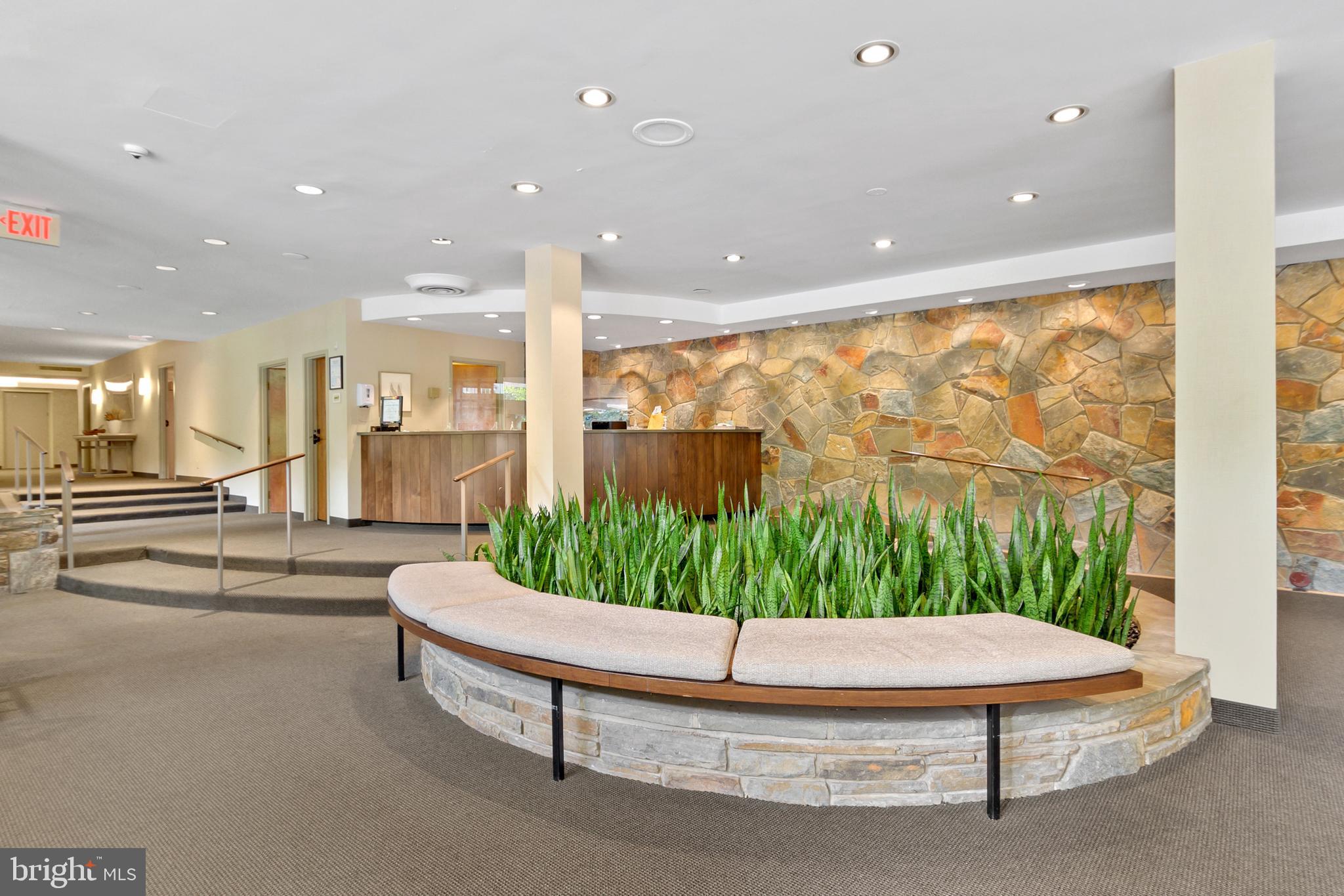 4100 Cathedral Avenue Northwest, Unit 709 Washington, DC 20016 - Photo 16 of 20 a living room with a large window and chairs