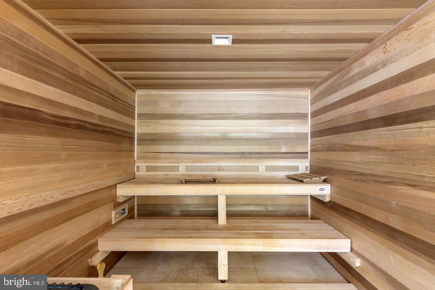 4100 Cathedral Avenue Northwest, Unit 709 Washington, DC 20016 - Photo 19 of 20 a view of a room with stairs and a ceiling fan