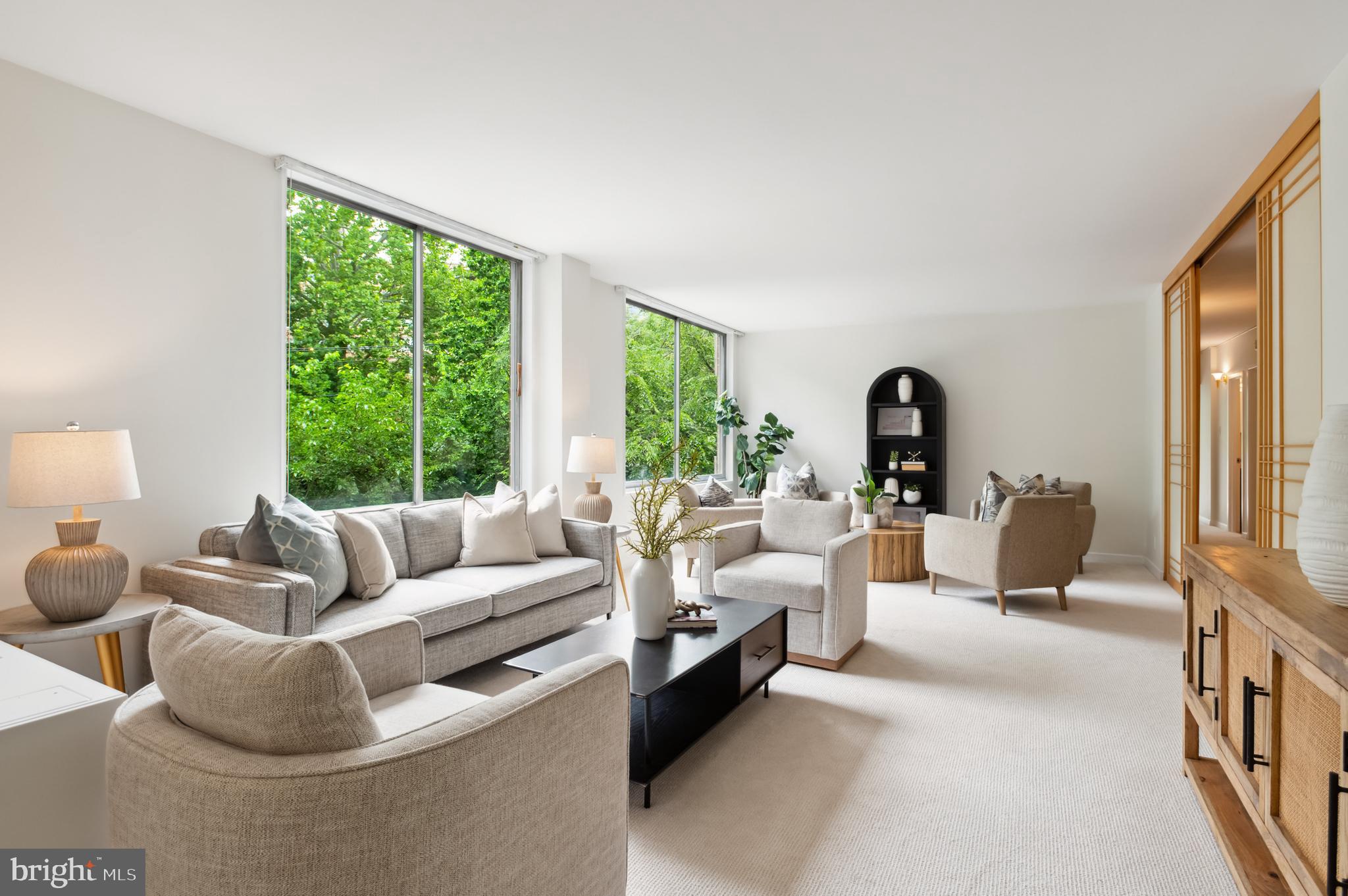 4100 Cathedral Avenue Northwest, Unit 709 Washington, DC 20016 - Photo 2 of 20 a living room with furniture and a large window