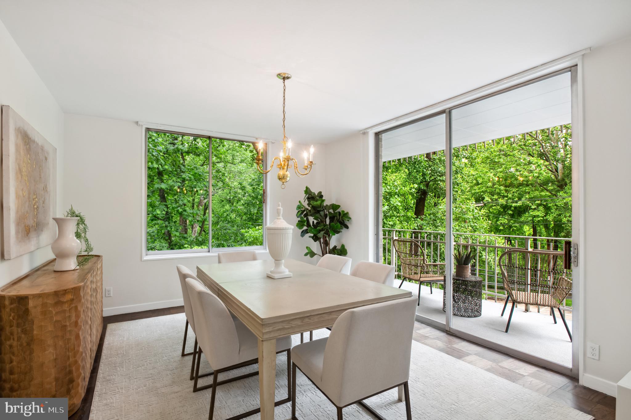 4100 Cathedral Avenue Northwest, Unit 709 Washington, DC 20016 - Photo 3 of 20 a view of a dining room with furniture window and outside view