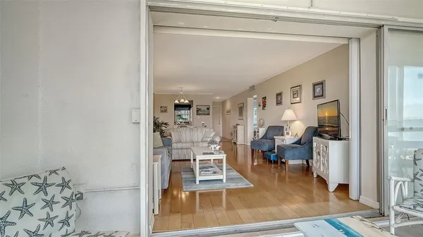 a view of a living room with furniture and a rug