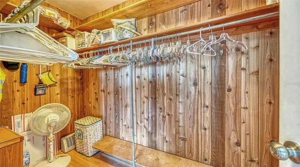 a view of a room with wooden floor and chair