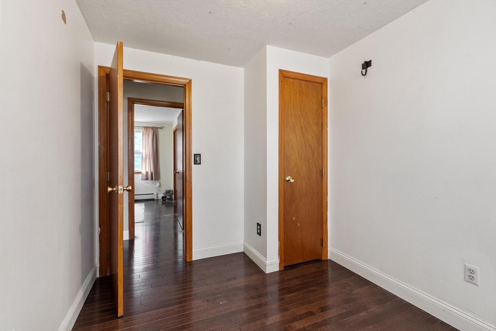681 Teel Road Winchendon, MA 01475 - Photo 12 of 27 an empty room and wooden floor