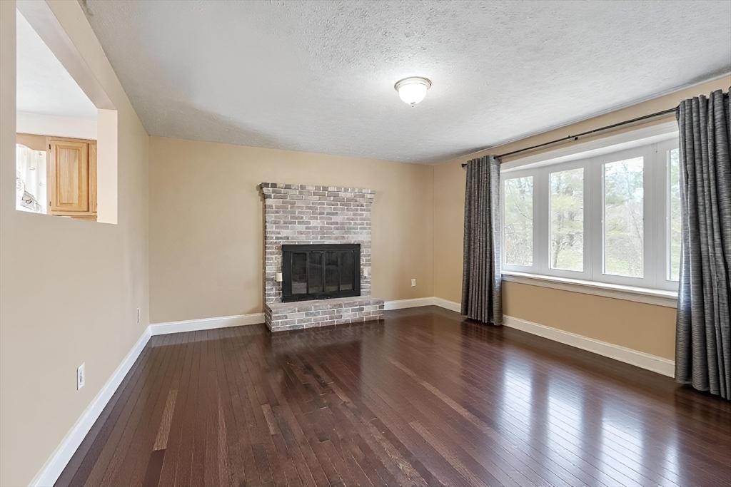 681 Teel Road Winchendon, MA 01475 - Photo 3 of 27 a view of an empty room with wooden floor and a window