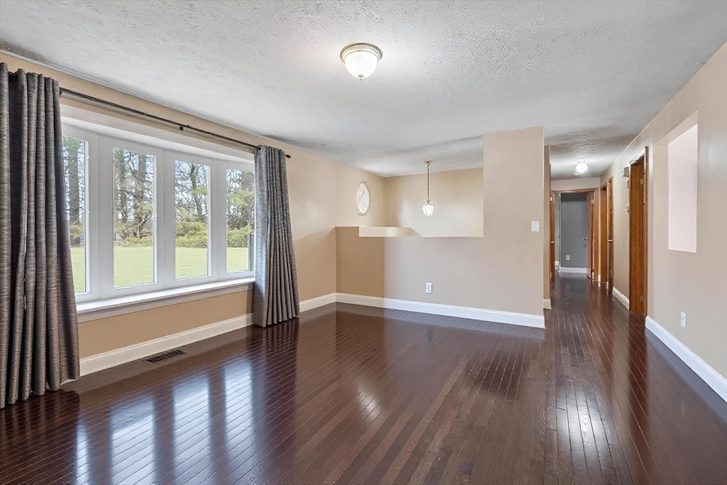 681 Teel Road Winchendon, MA 01475 - Photo 4 of 27 a view of an empty room with wooden floor and a window