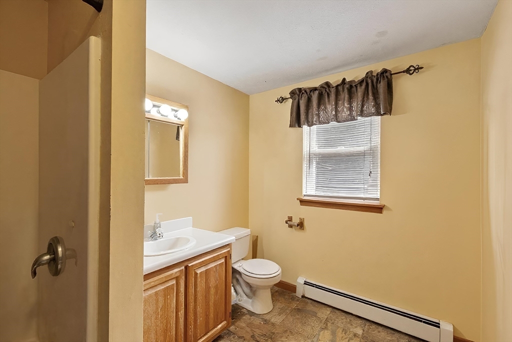 681 Teel Road Winchendon, MA 01475 - Photo 7 of 27 a bathroom with a toilet a sink and mirror