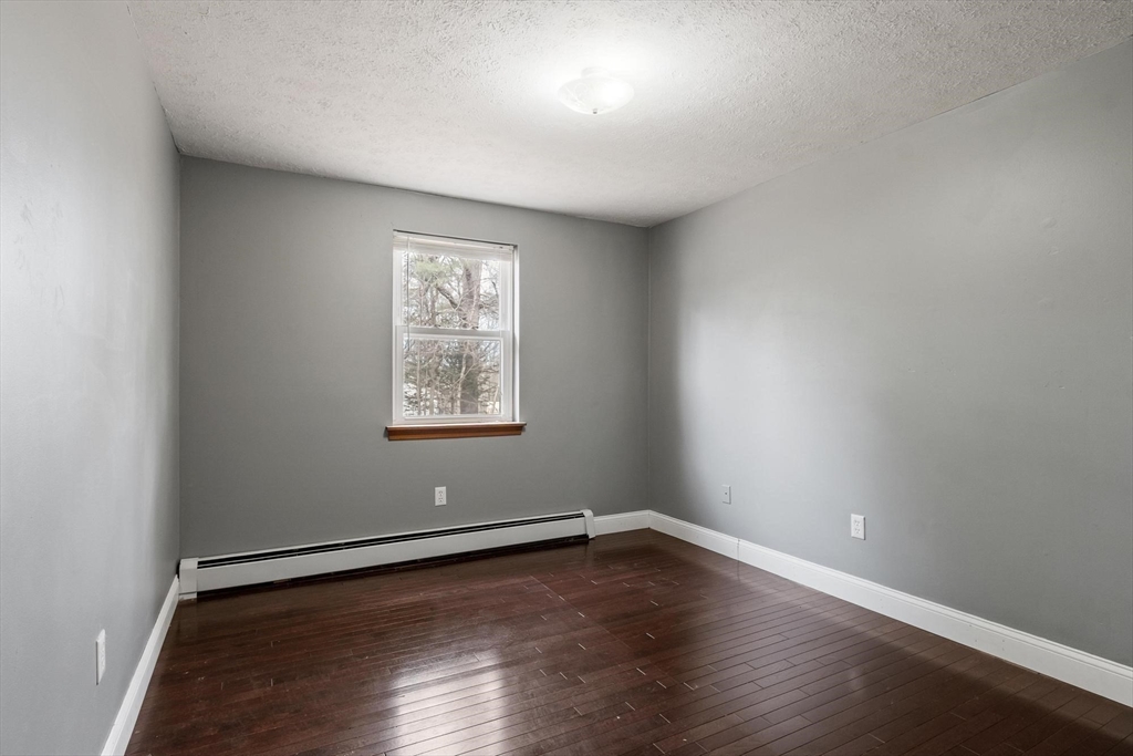 681 Teel Road Winchendon, MA 01475 - Photo 9 of 27 a view of a room with wooden floor and window