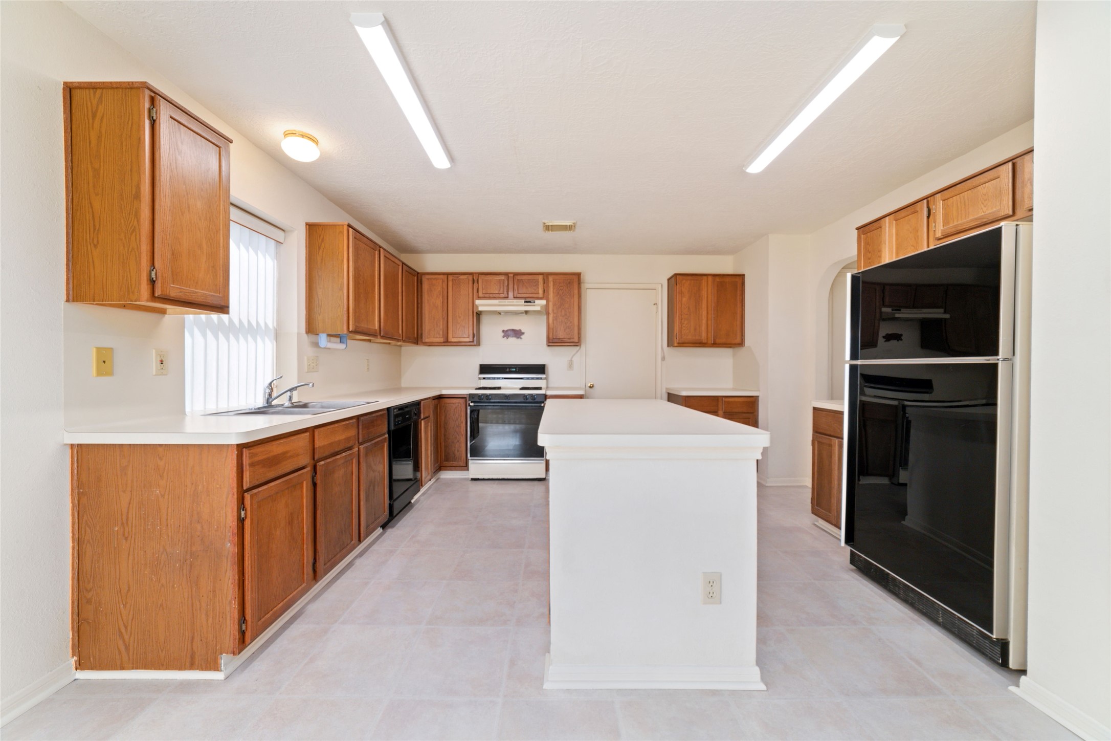 3327 Keygate Drive Spring, TX 77388 - Photo 17 of 37 a large kitchen with cabinets stove top oven and sink