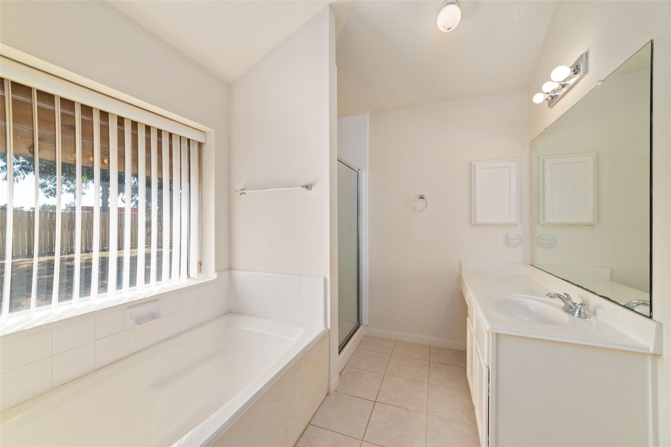 3327 Keygate Drive Spring, TX 77388 - Photo 29 of 37 a bathroom with a bathtub and a sink