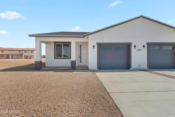 front view of a house with a yard