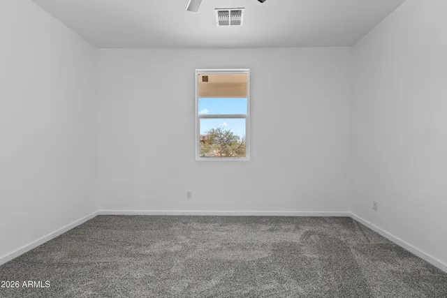 a view of an empty room and closet