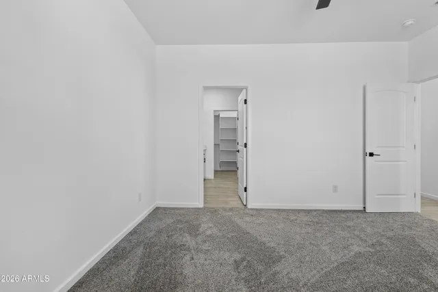 a spacious bathroom with double vanity and mirrors
