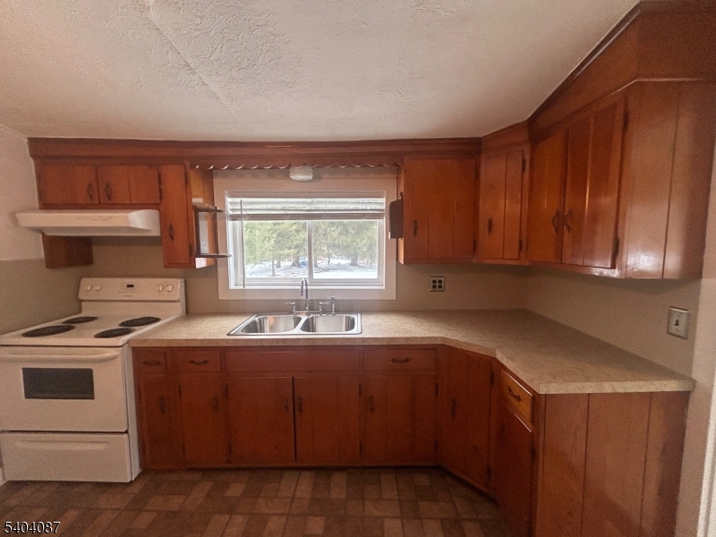 223 Goat Hill Road West Amwell, NJ 08530 - Photo 11 of 17 a kitchen with a sink stove and cabinets