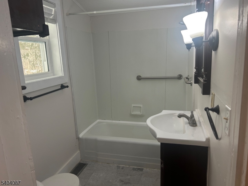 223 Goat Hill Road West Amwell, NJ 08530 - Photo 13 of 17 a bathroom with a sink a toilet and shower