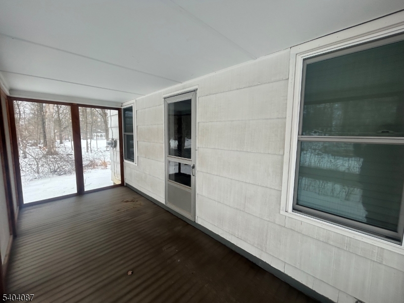223 Goat Hill Road West Amwell, NJ 08530 - Photo 16 of 17 a view of an empty room with wooden floor and a window