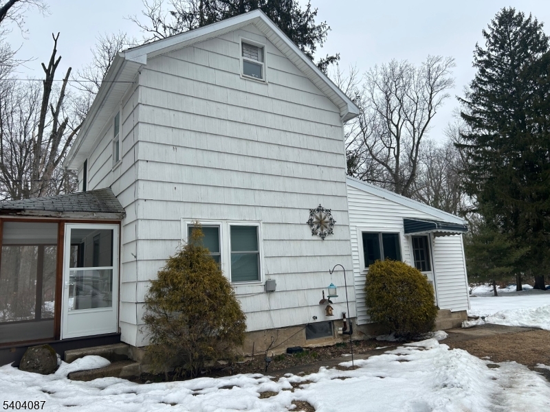 223 Goat Hill Road West Amwell, NJ 08530 - Photo 2 of 17 a front view of a house with a yard and garage