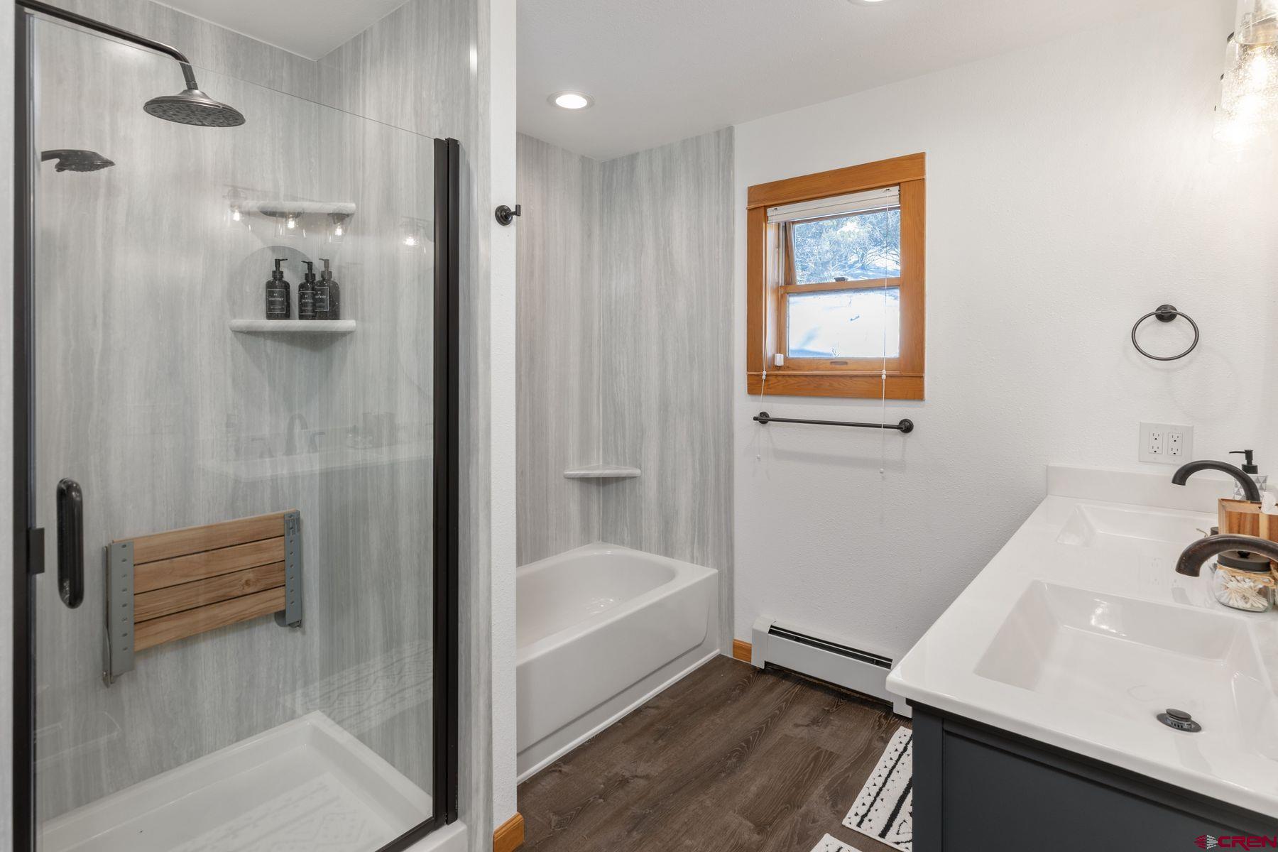 125 County Road 7A Ridgway, CO 81432 - Photo 13 of 40 a bathroom with a bathtub and a sink