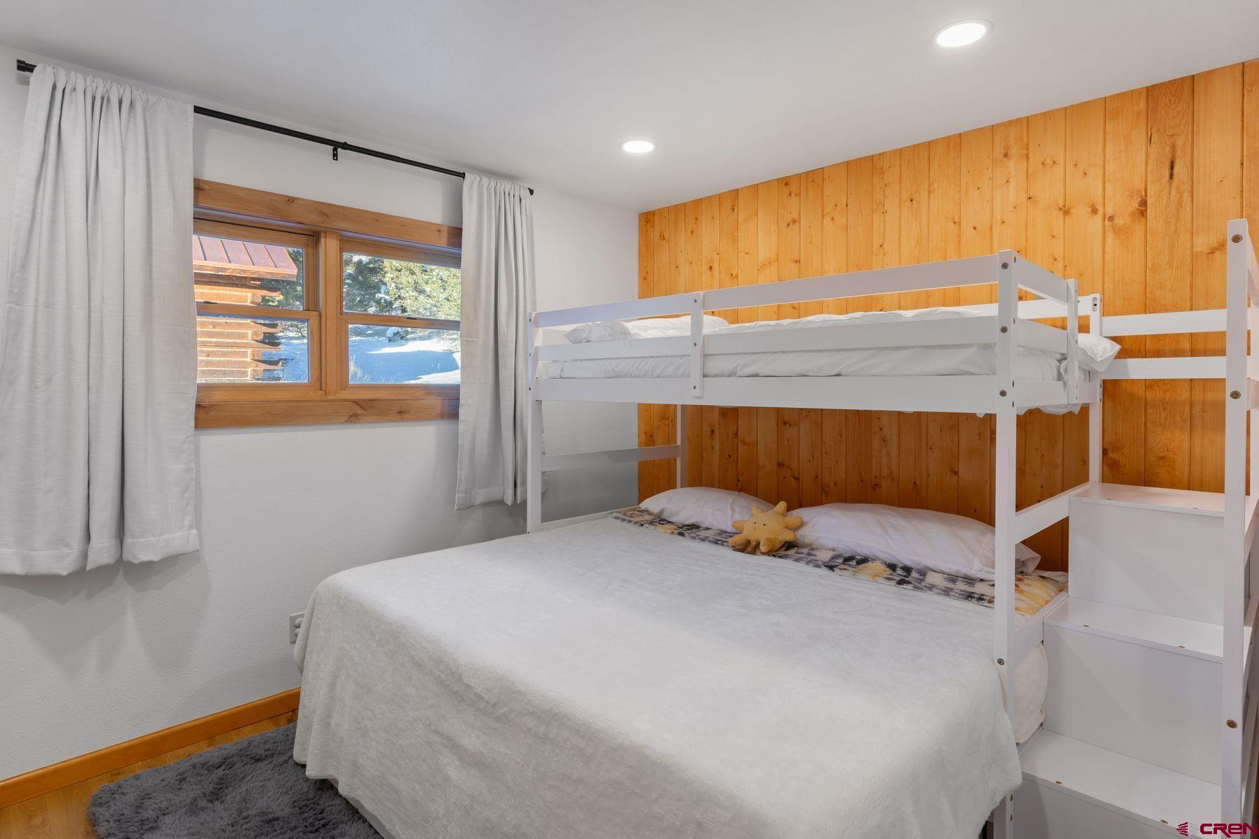 125 County Road 7A Ridgway, CO 81432 - Photo 14 of 40 a bedroom with a bed and a dresser