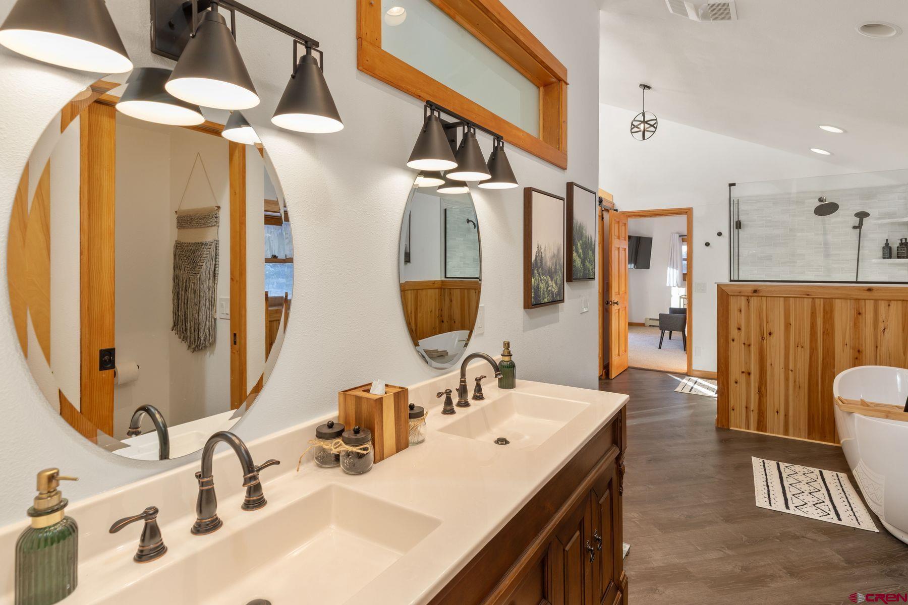 125 County Road 7A Ridgway, CO 81432 - Photo 38 of 40 a bathroom with a double vanity sink and a mirror