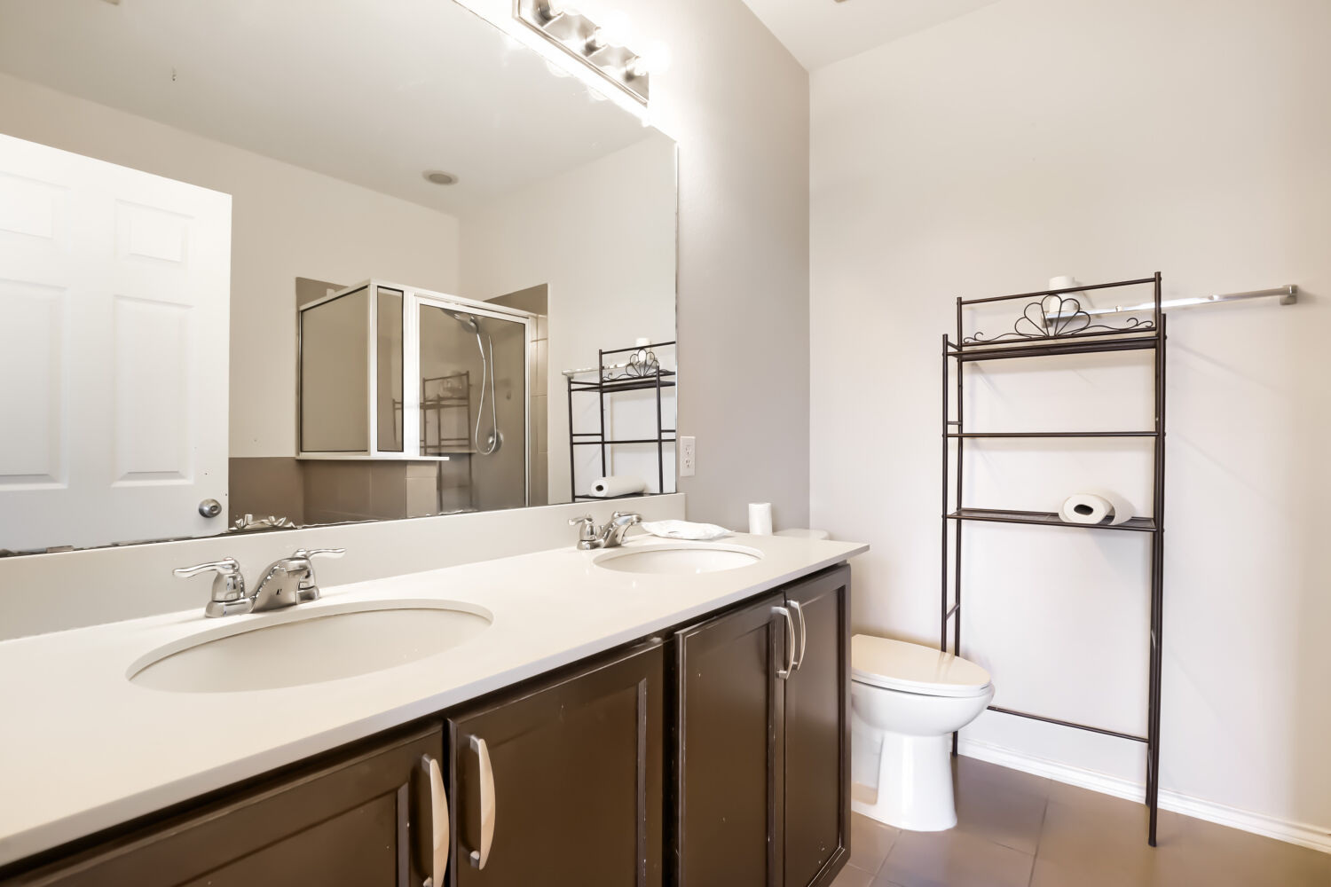 153 Marcheeta Way Leander, TX 78641 - Photo 9 of 17 Clean lines and a spacious dual vanity define this functional bathroom.