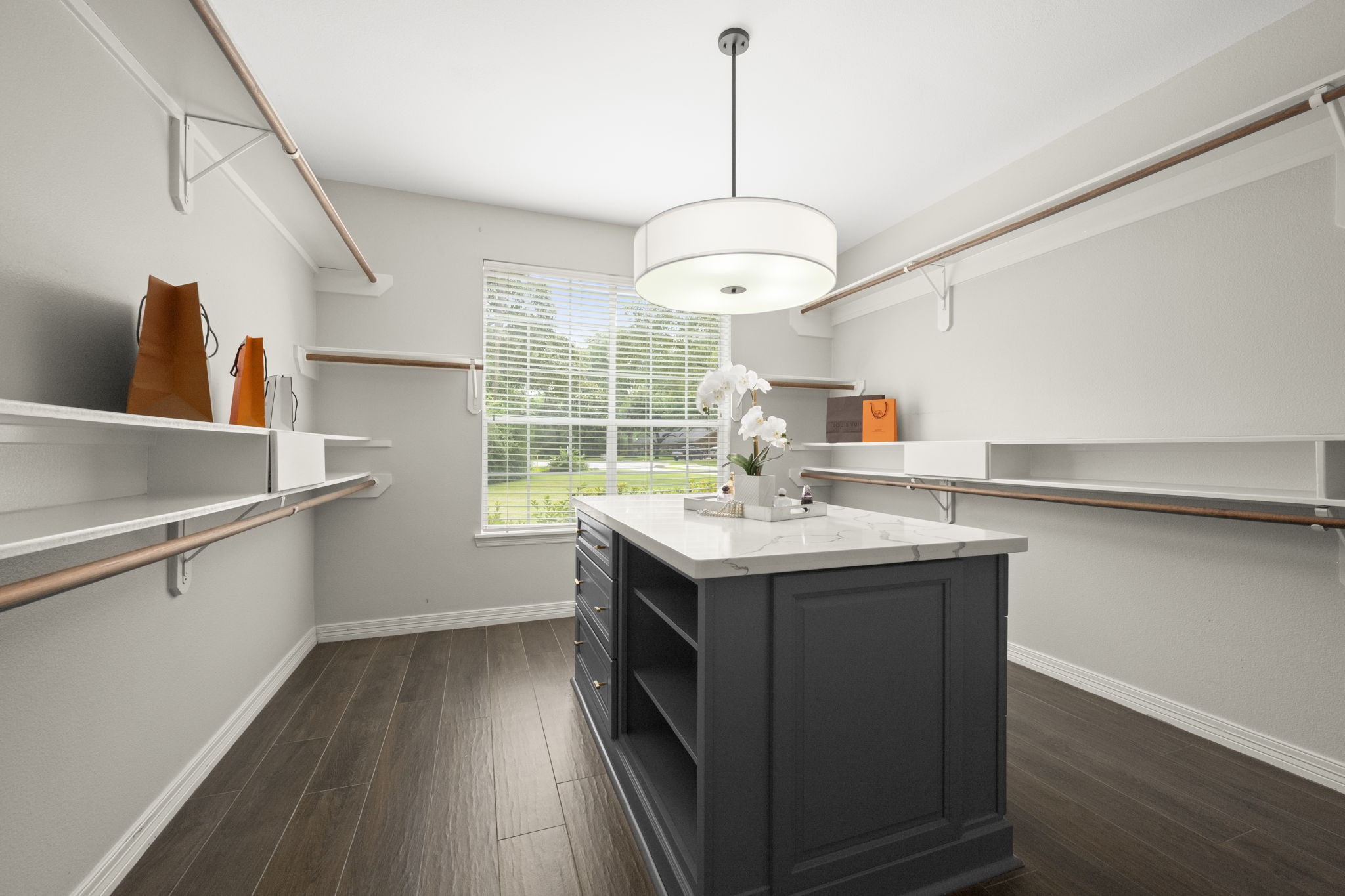 2326 Timbergreen Circle Magnolia, TX 77355 - Photo 21 of 43 a kitchen with a sink a chandelier and wooden floor