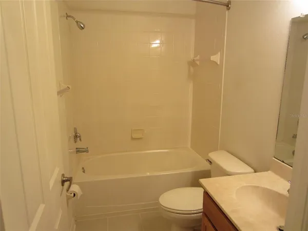 a bathroom with a toilet and shower