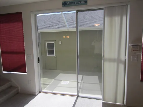 a bathroom with a glass shower door
