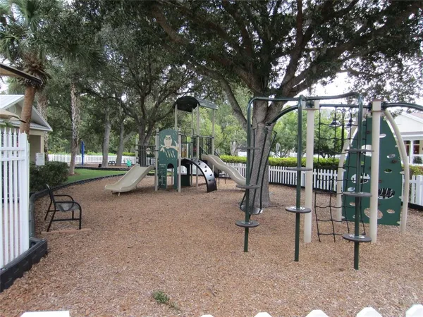a view of a park with swings and slides
