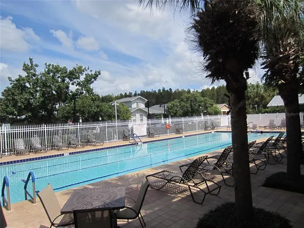 a view of a wooden deck with a yard