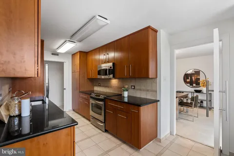 a kitchen with a stove and a sink