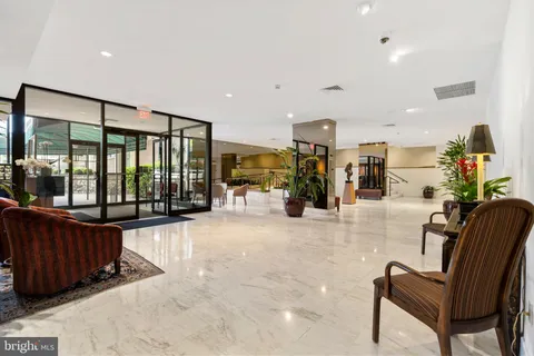a view of a living room filled with furniture