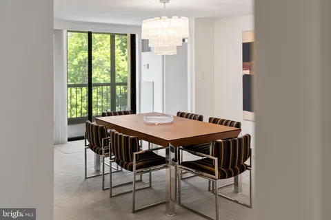 a view of a dining room with furniture and window