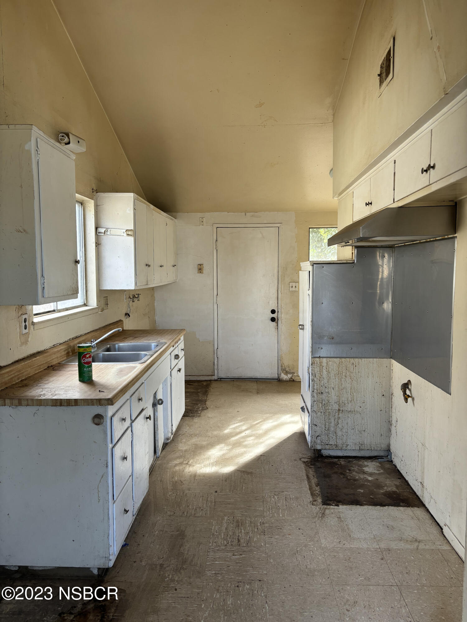 232 West Creston Street Santa Maria, CA 93458 - Photo 3 of 7 a kitchen with a sink stove and cabinets