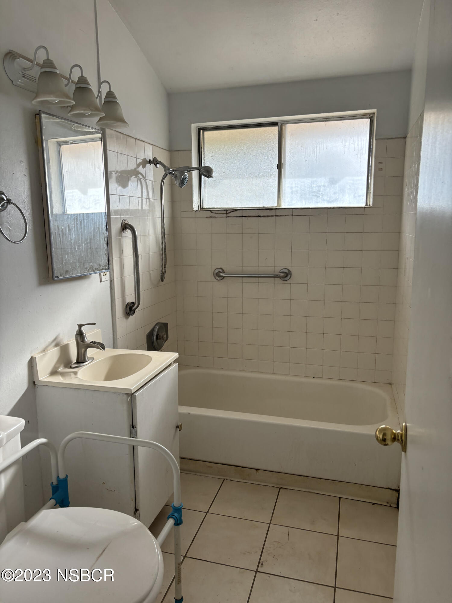 232 West Creston Street Santa Maria, CA 93458 - Photo 6 of 7 a bathroom with a toilet sink and mirror